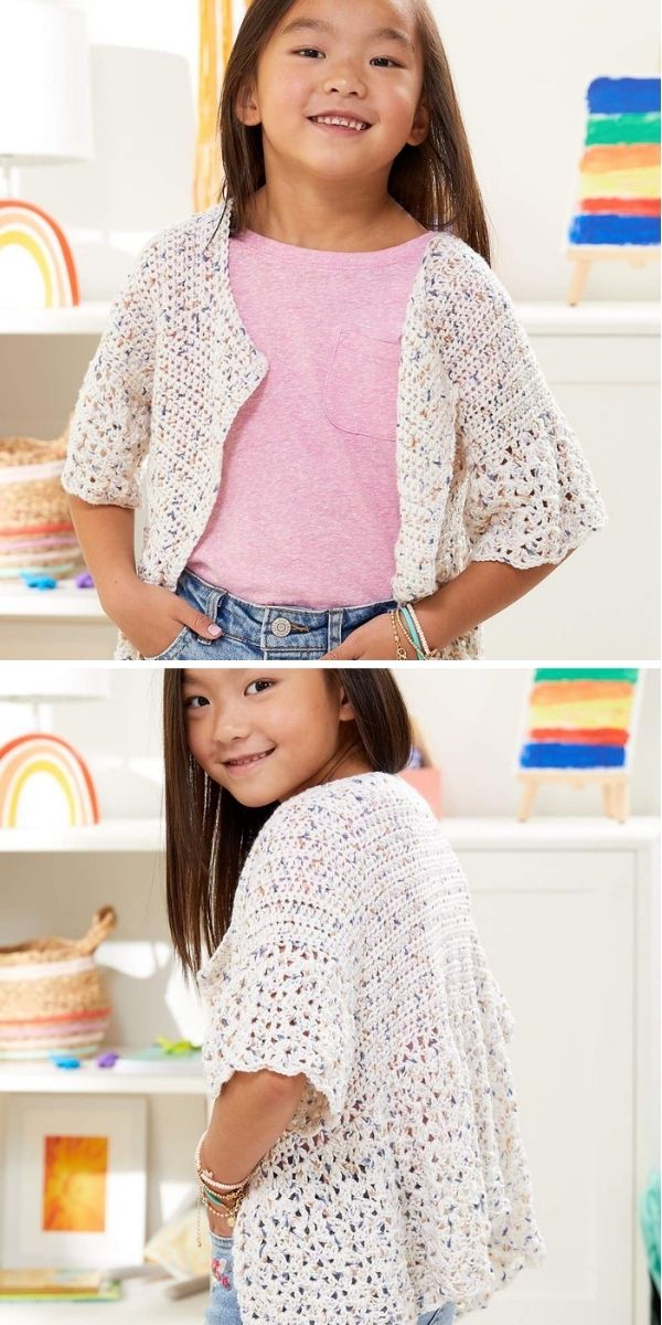 Young girl wearing a light pink shirt and a stylish crochet cardigan with short sleeves, shown from the front and back, standing indoors in a colorful room. This charming look highlights the beauty of crochet cardigans for youngsters.
