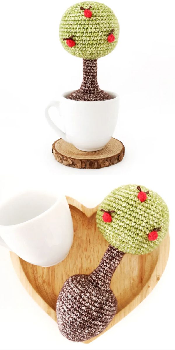 A cup with a knitted amigurumi cactus on top.