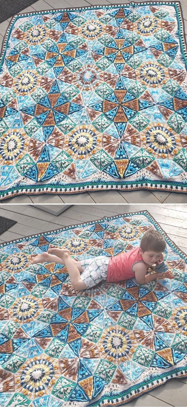 A vibrant geometric crochet throw, featuring star and hexagon patterns, adorns the floor. A child rests on it, dressed in a pink shirt and patterned shorts, adding a touch of joy to the scene.
