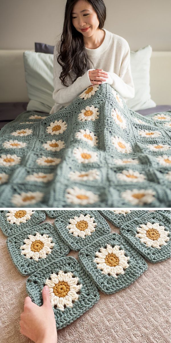 A woman is holding a crocheted daisy throw.