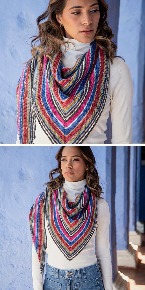 A woman wearing a vibrant knitted shawl.
