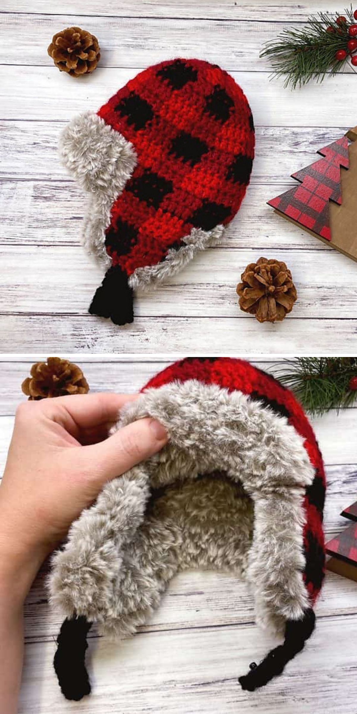 A red and black checkered crochet hat with a furry lining is artfully displayed on a wooden surface, paired with pinecones and a small evergreen branch. A hand presents the hat, revealing its cozy interior, reminiscent of a classic men's crochet hat pattern.