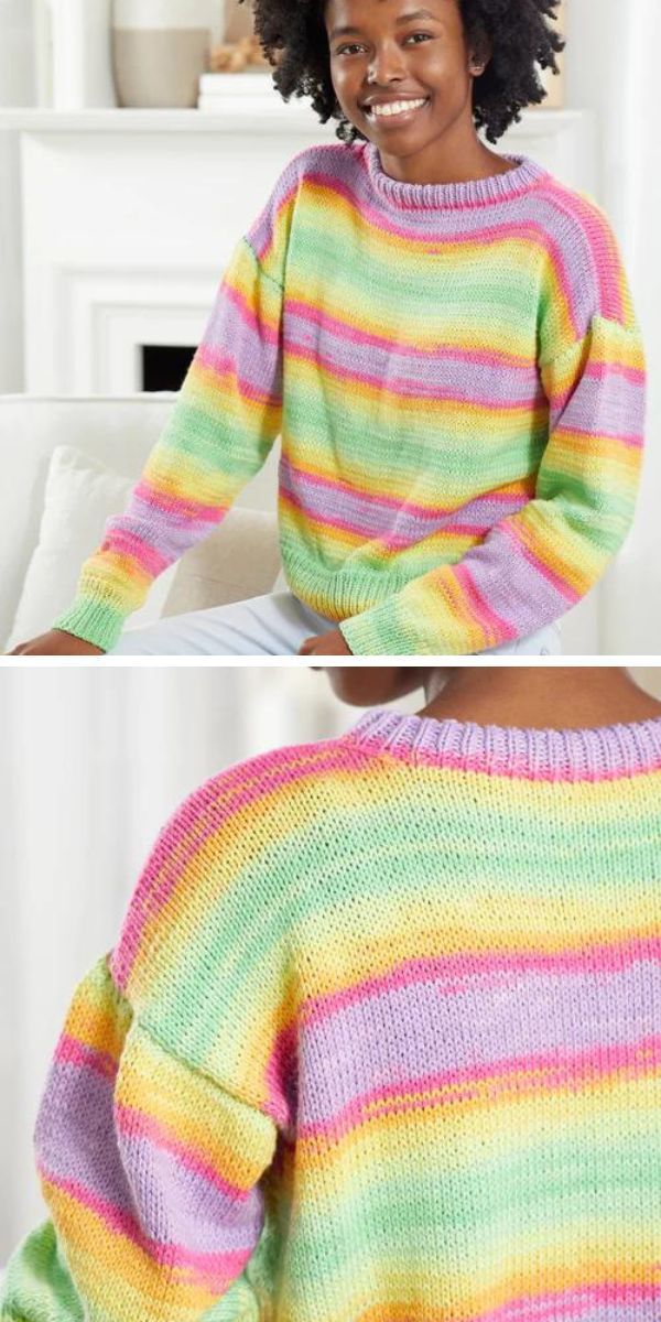 A woman is wearing a knitted rainbow-striped sweater.