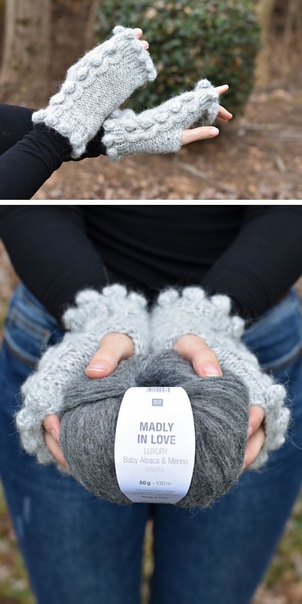 A woman is holding a ball of yarn and a pair of knitted mittens.