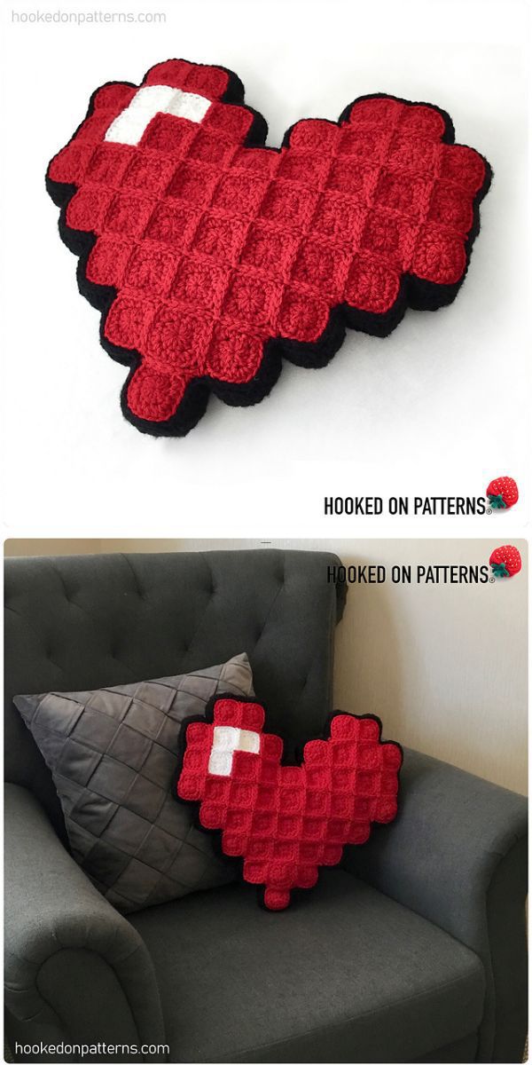 A crochet heart pillow on a couch.