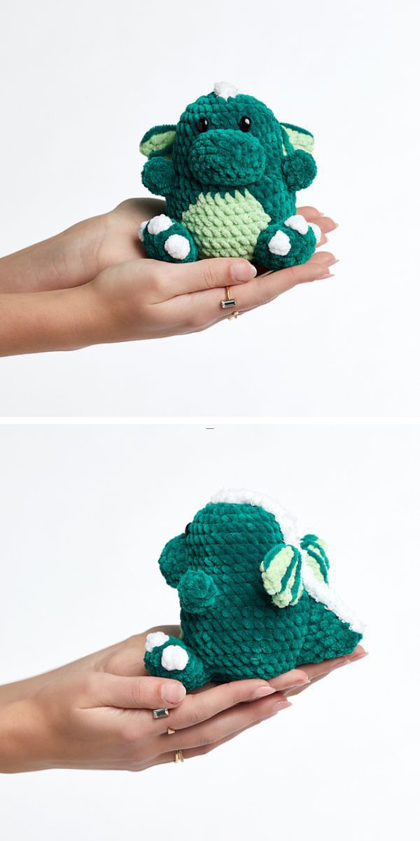 A pair of hands holding a green crochet dragon.