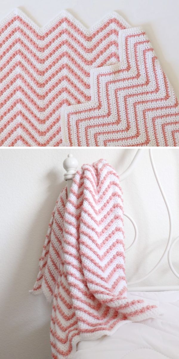 A chevron-patterned baby blanket in shades of pink and white draped over the back of a white chair.
