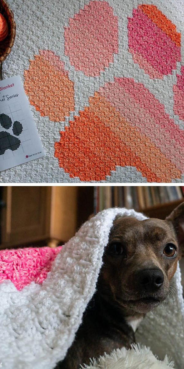 A handmade crochet blanket with paw print design on top, and a small dog peeking out from under a similar blanket below.