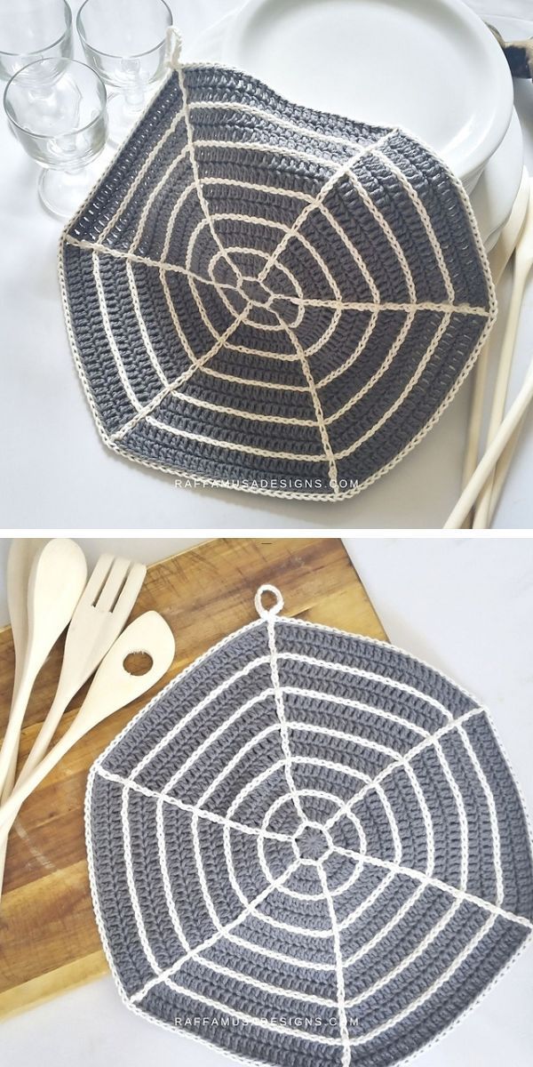 Handmade crochet dishcloth with a spiral design displayed on a wooden table, accompanied by cutlery and glassware.