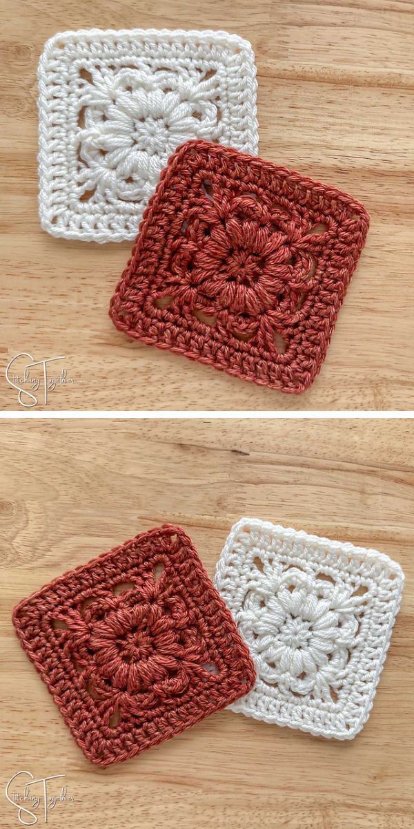 two crochet granny squares with a flower motif in red and in white laid on a wooden floor