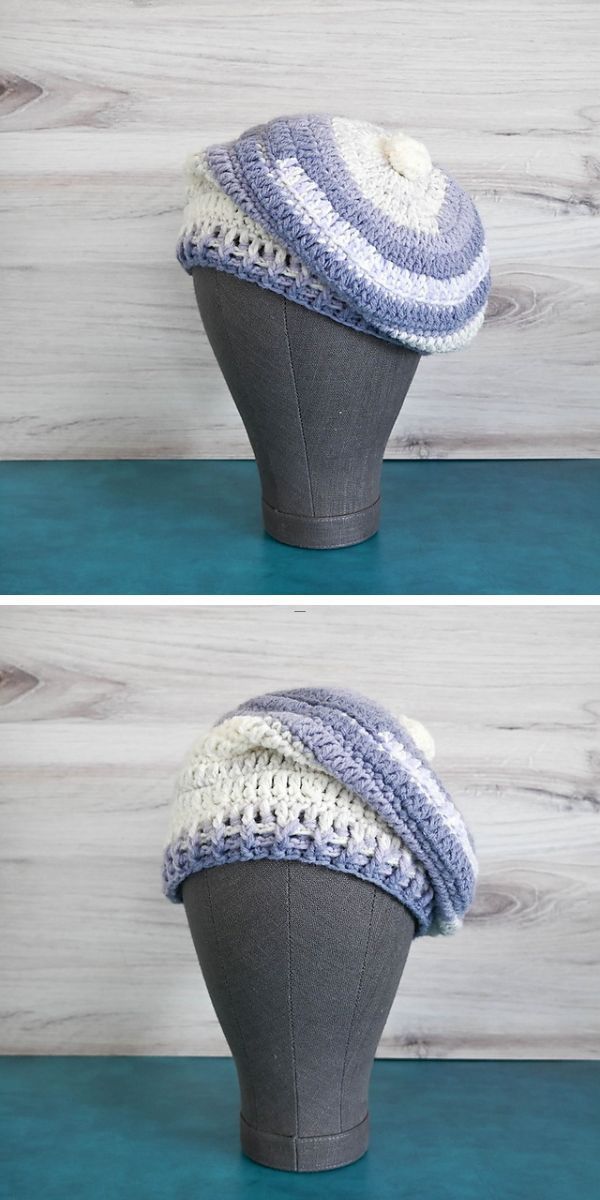 a striped crochet slouch beanie in a white and blue color on a mannequin