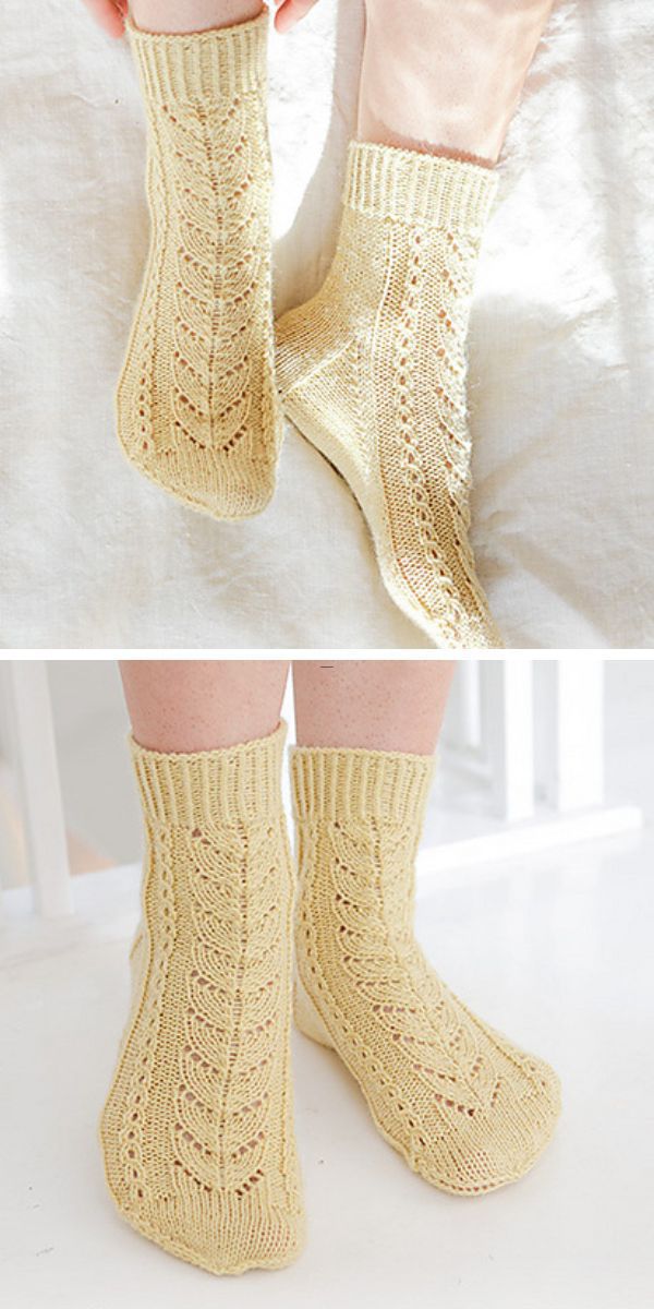 a person wearing knitted socks with a leaf lace design in a light yellow color