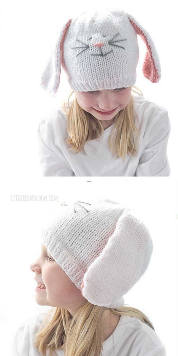 a little girl wearing a white knitted hat wiith a bunny face and floppy ears