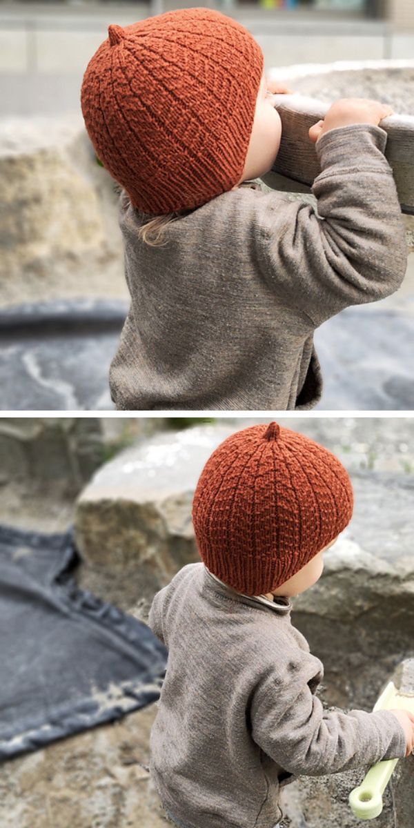a baby wearing an orange pumpkin knitted beanie
