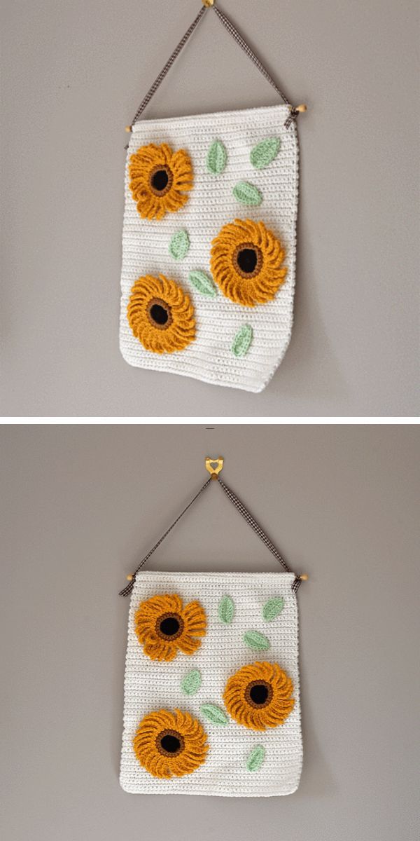 a crochet wall-hanging with sunflowers on it
