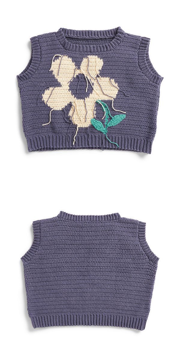 a cropped crochet vest with a flower design on it