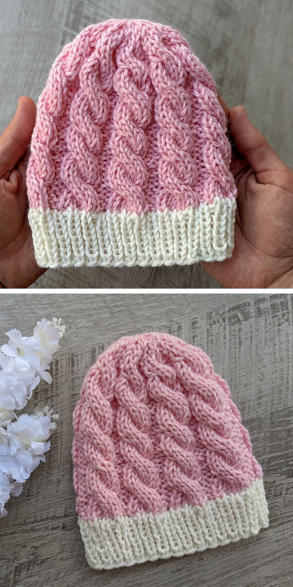 a pink knitted baby hat with cables