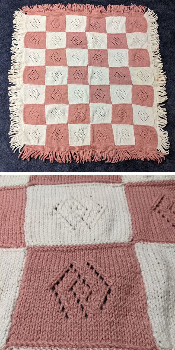 a knit baby blanket with a plaid pink-and-white design