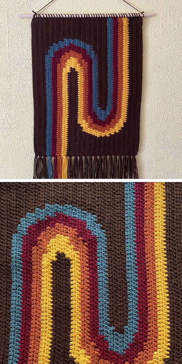 a crochet wall hanging with a colorful motif