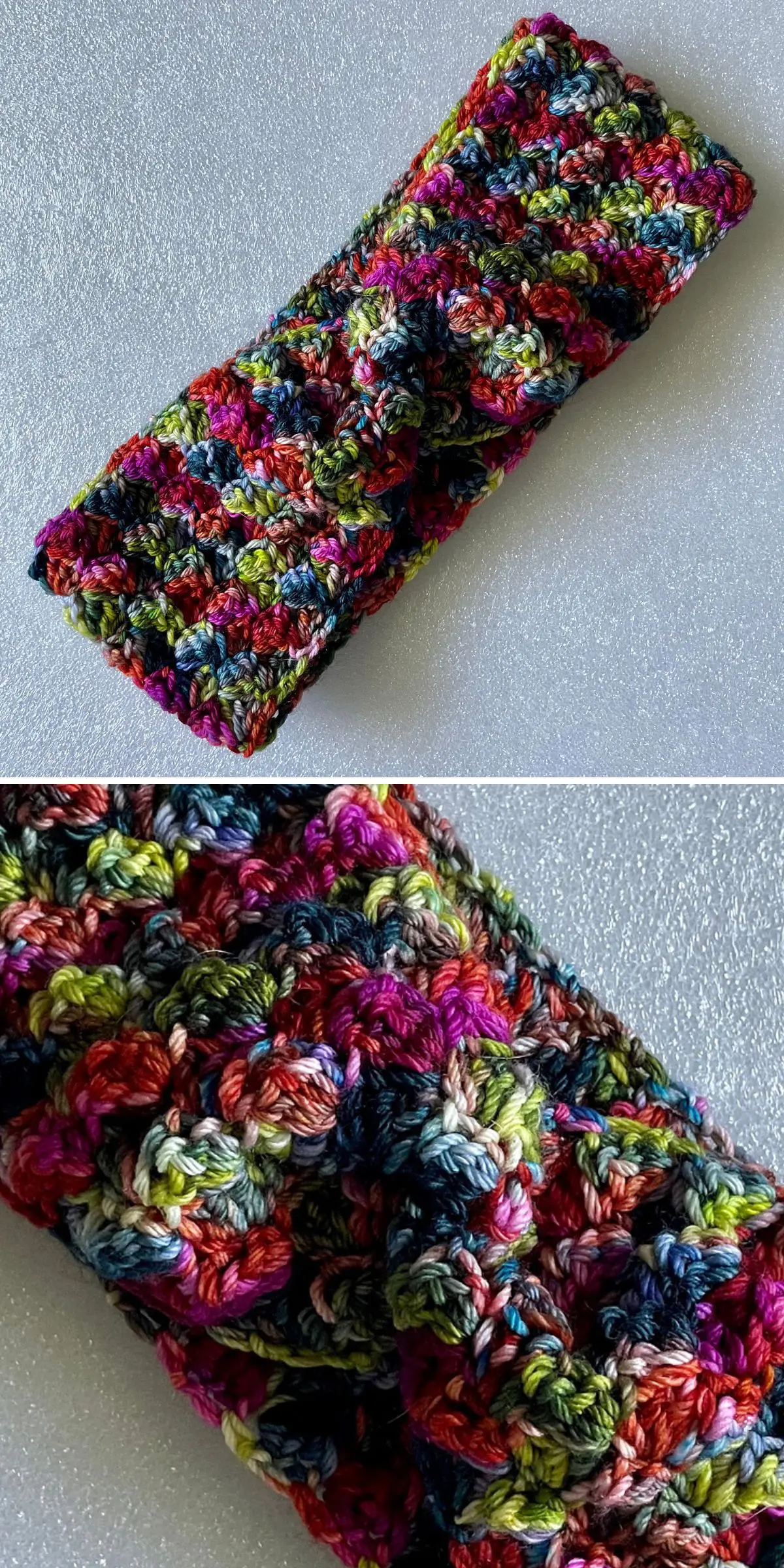 A vibrant crochet headband with a twist pattern is showcased on a textured gray surface. The close-up reveals intricate stitching and multi-colored hues.
