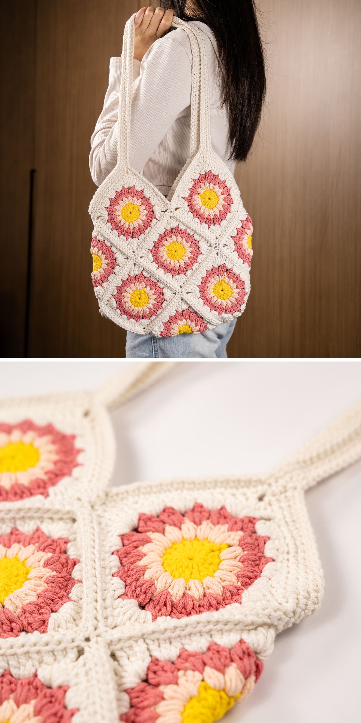 A person holds a vibrant crochet bag adorned with colorful floral patterns, showcasing white, pink, and yellow yarn.