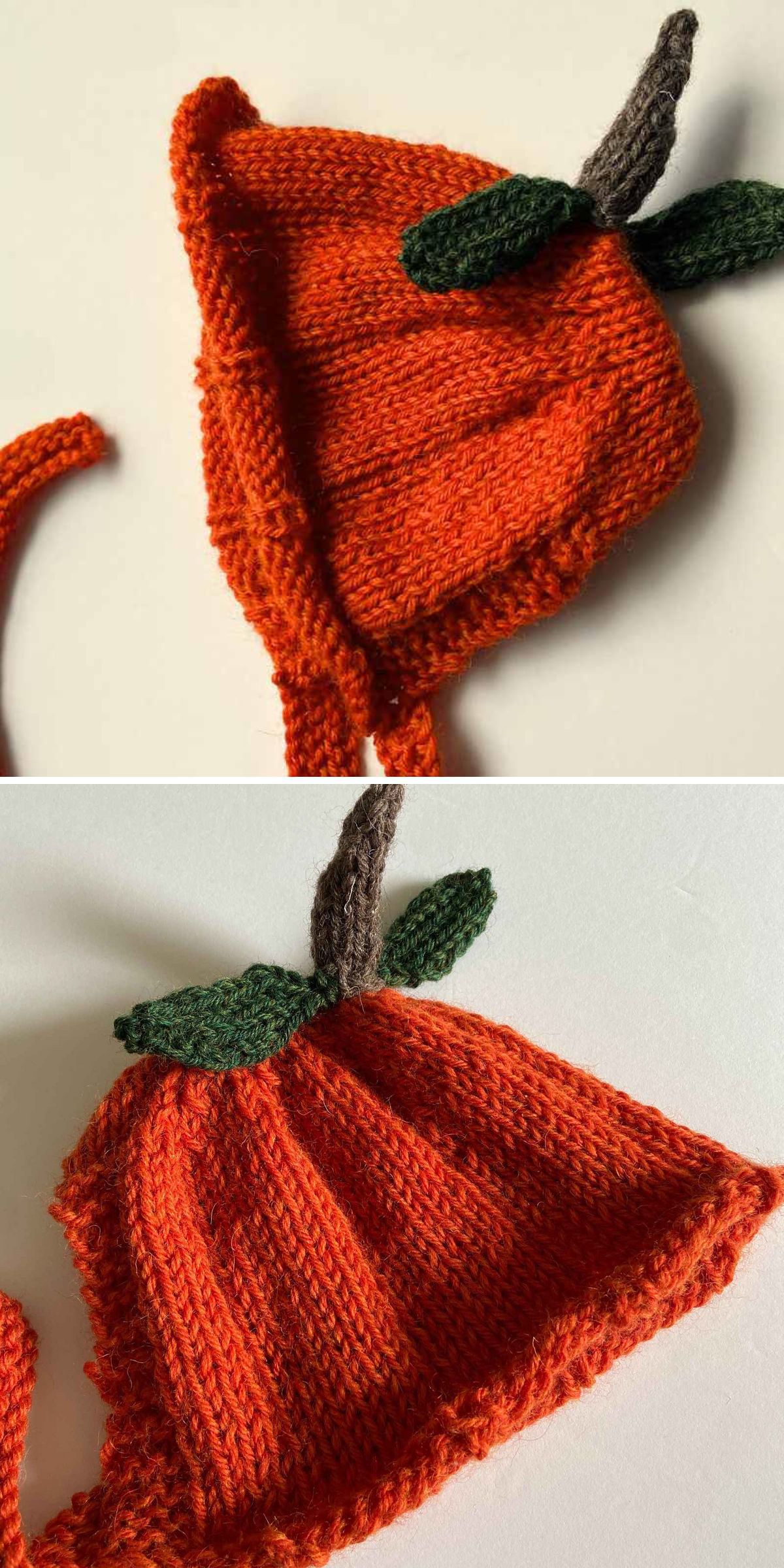 A charming knitted baby bonnet, this orange hat features delightful green leaf and stem embellishments, perfectly resembling a pumpkin.