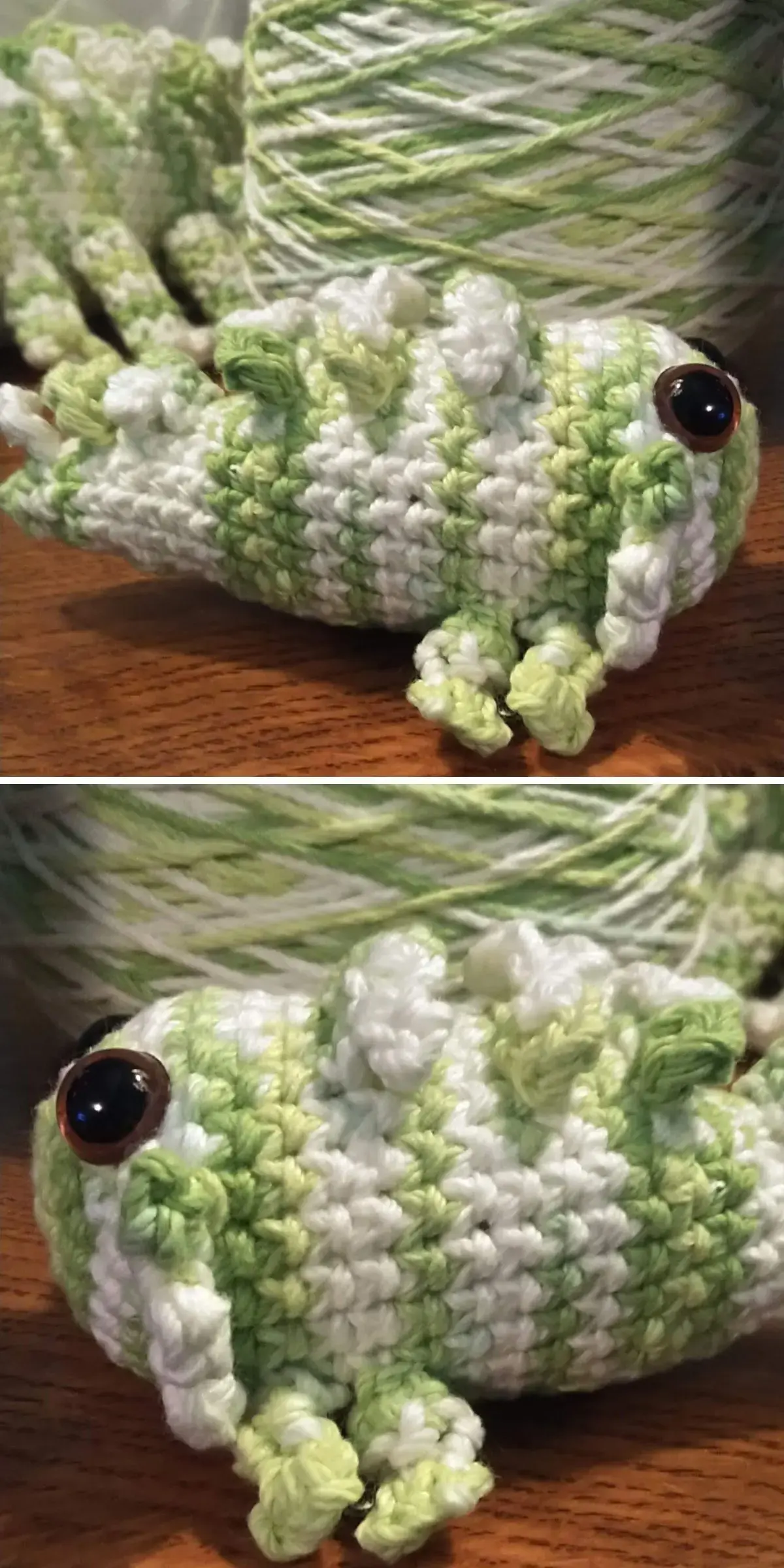 A crocheted grasshopper, adorned in green and white with striking black eyes, rests on a wooden surface.