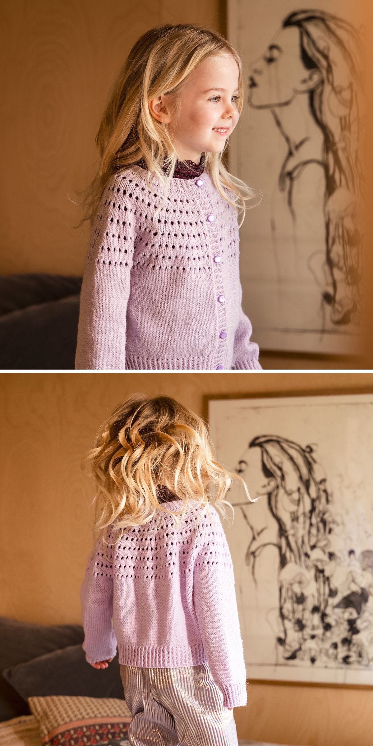 A young girl with blonde hair wears a light purple knitted cardigan and striped pants, standing indoors near a wall with a framed sketch of a woman.