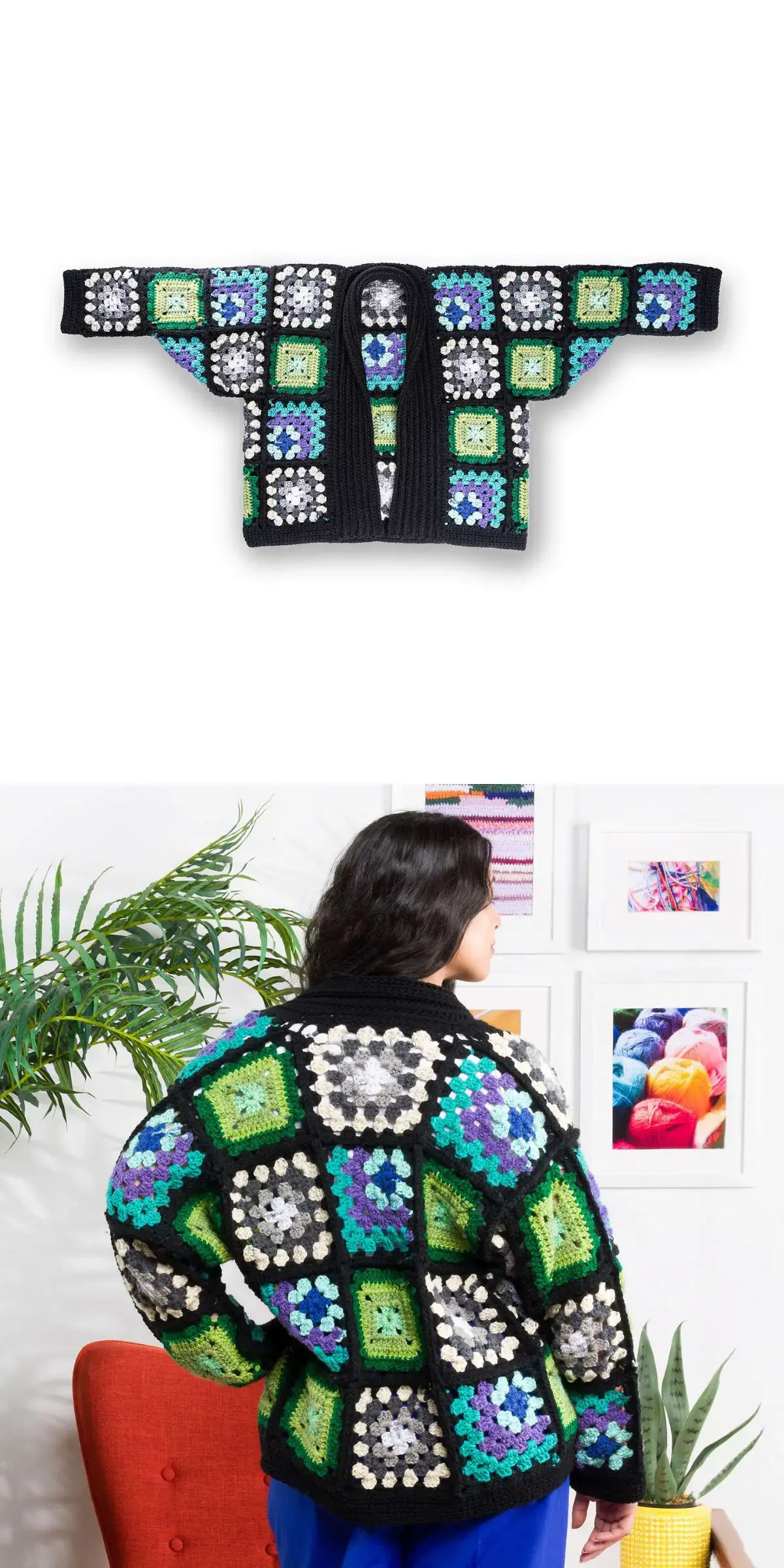 Granny square crochet cardigan featuring a black base with green, blue, and white squares, displayed flat and worn by a person standing near a red chair and a potted plant.