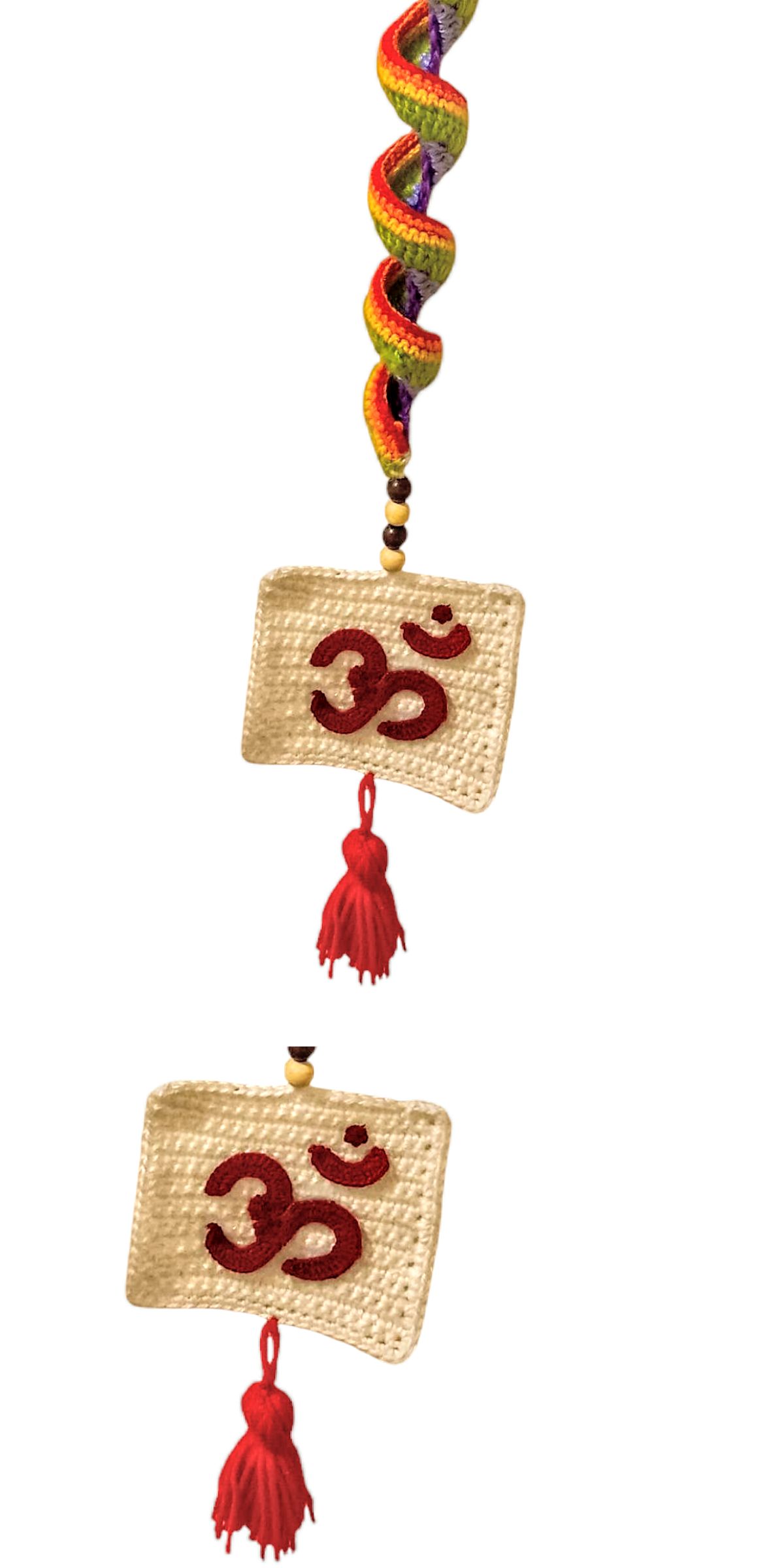 a crochet wind spinner with a colorful spiral hanging tail and a rectangular bottom with Chinese inscriptions