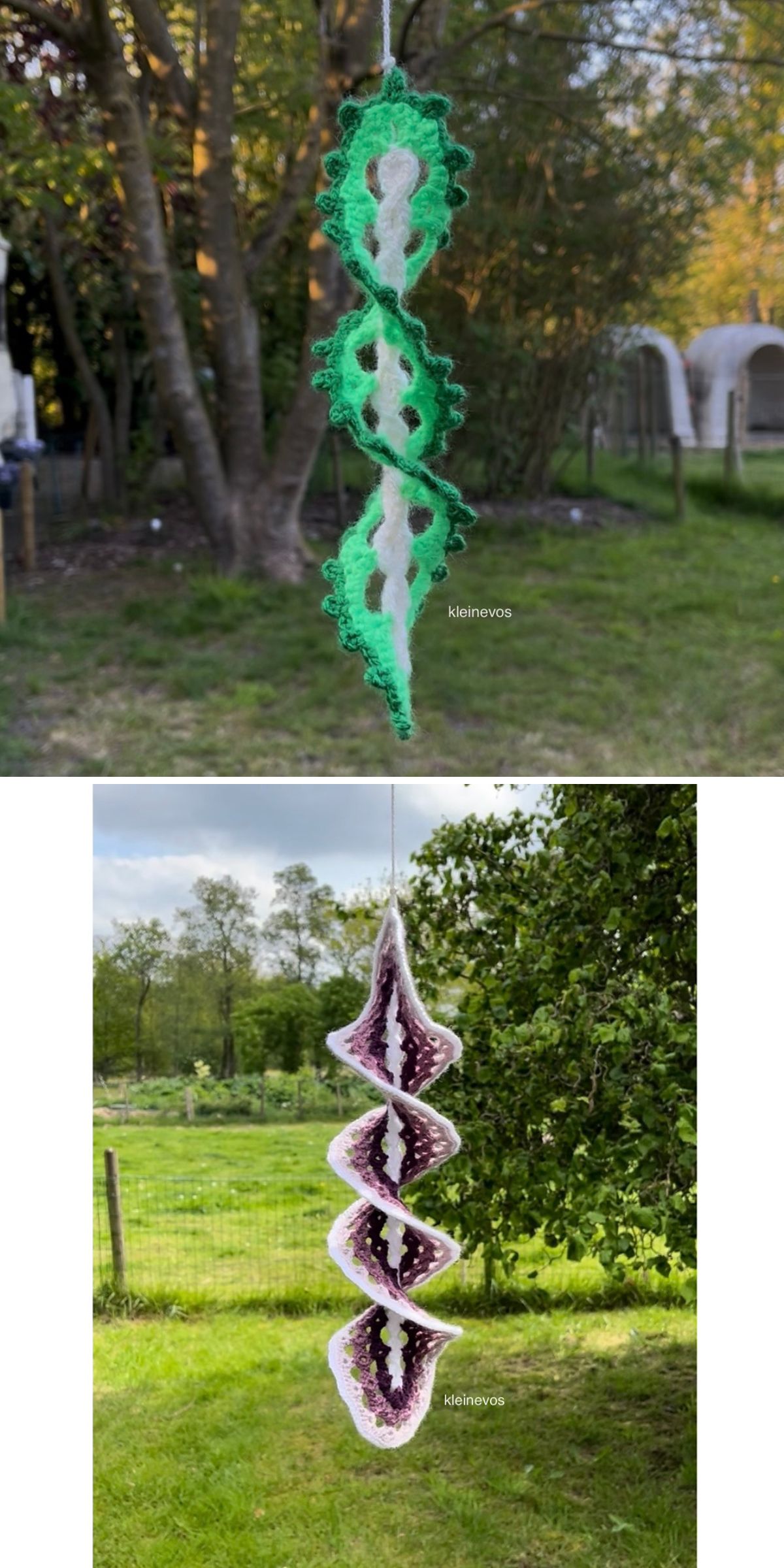 Two crochet windspinners hang outdoors on string; the top one is green, the bottom is purple and white, both displayed in a grassy, tree-filled yard.