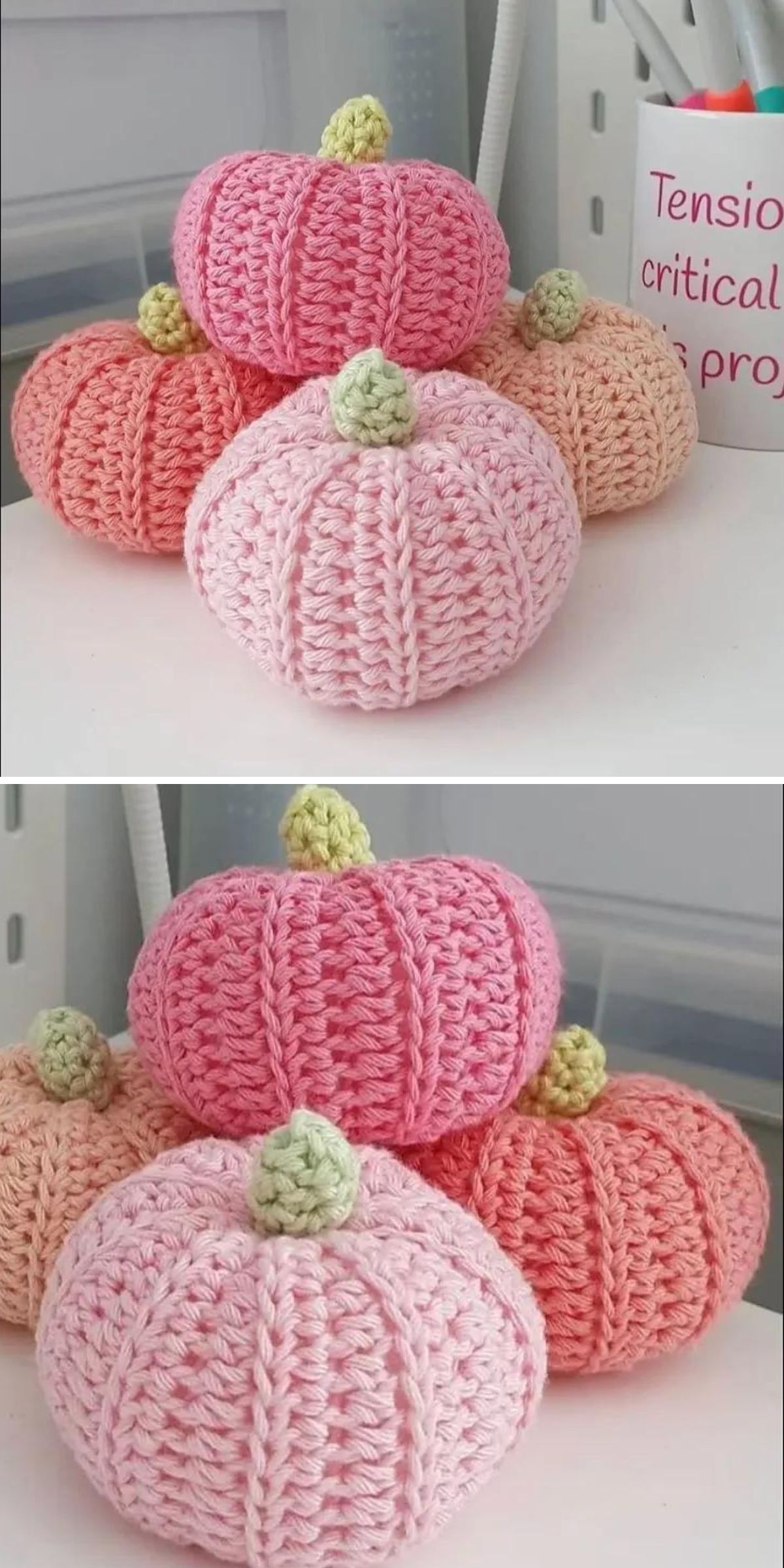 Several crochet pumpkins in shades of pink, peach, and orange are arranged together, each with a small green stem.