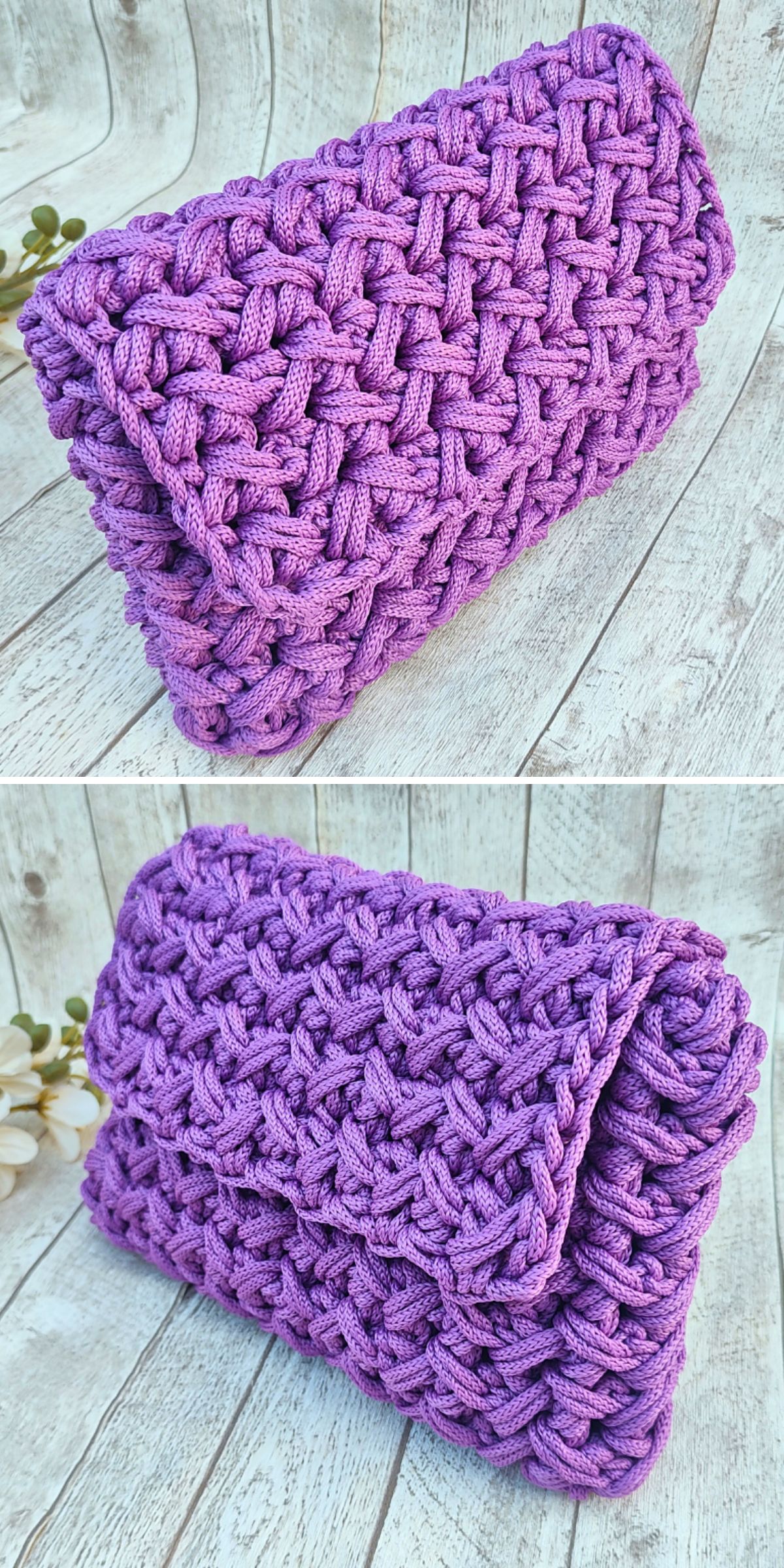 A purple handwoven crochet clutch purse with a textured, chunky knit pattern, displayed on a light wooden surface with a small flower decoration nearby.