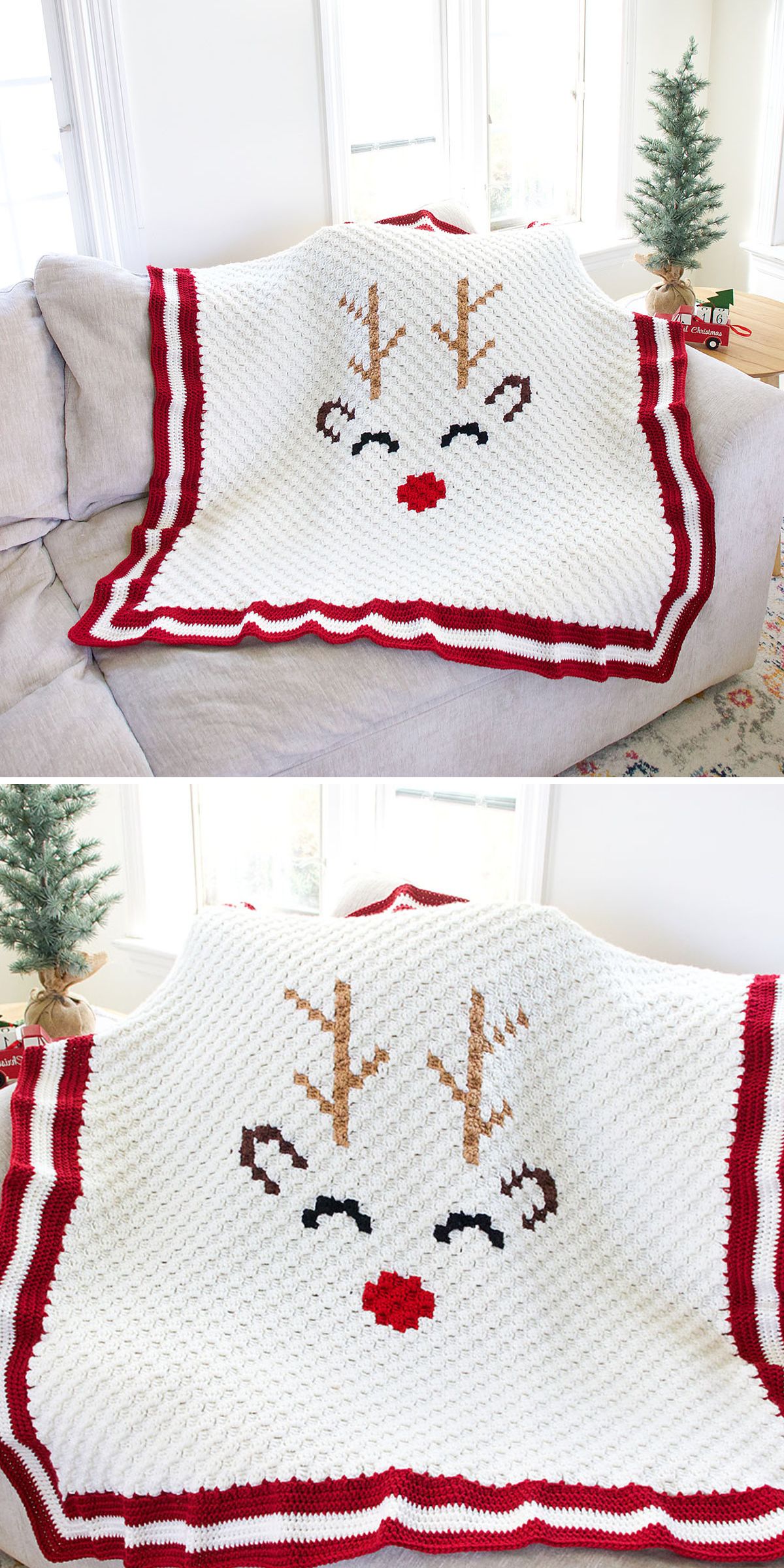 A white Christmas crochet blanket with red borders features a reindeer face design, complete with antlers, eyes, ears, and a red nose, draped over a couch near small Christmas trees.