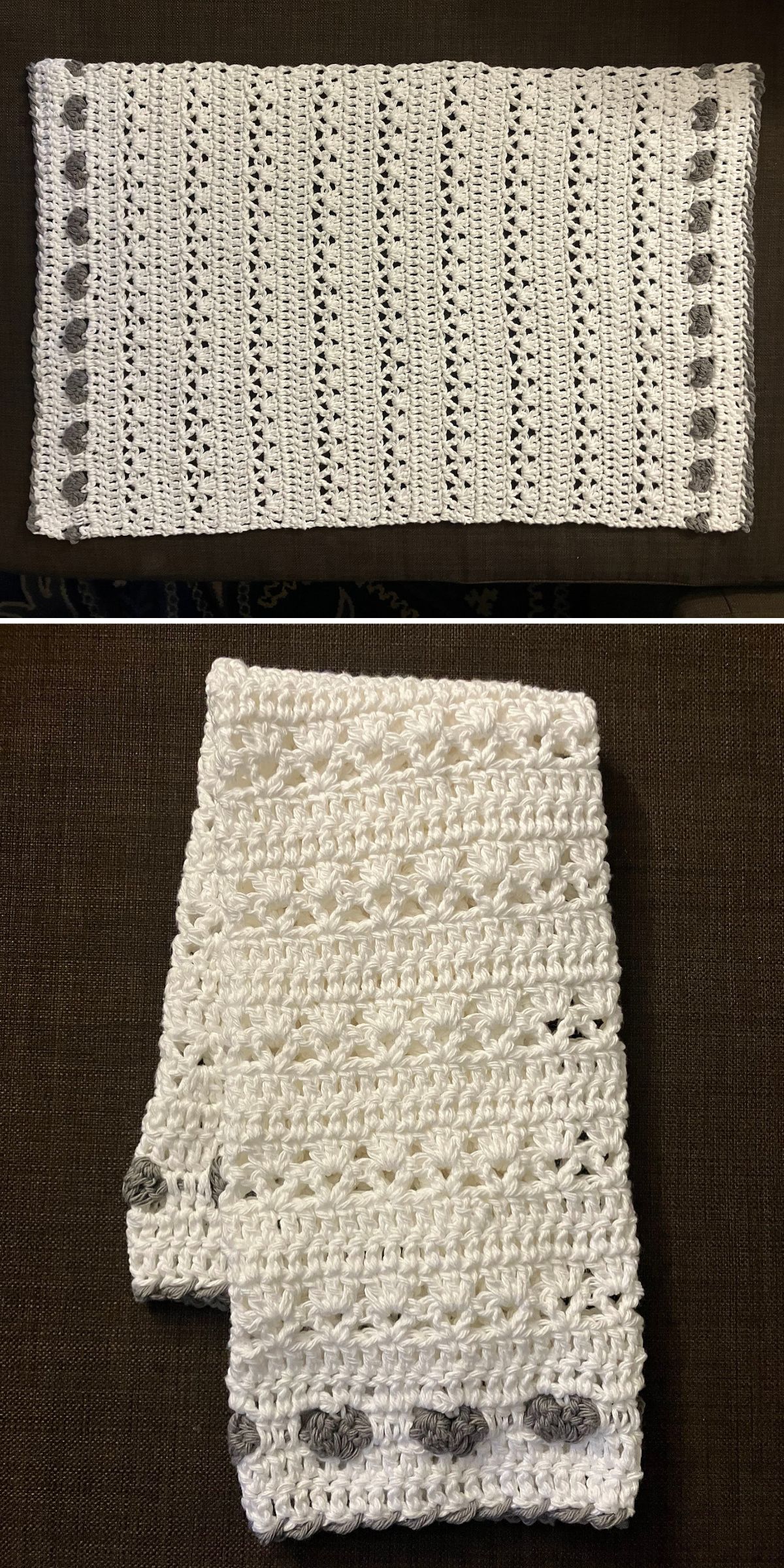 A white crocheted hand towel with a pattern of rows and gray accents along one edge, shown laid flat and folded
