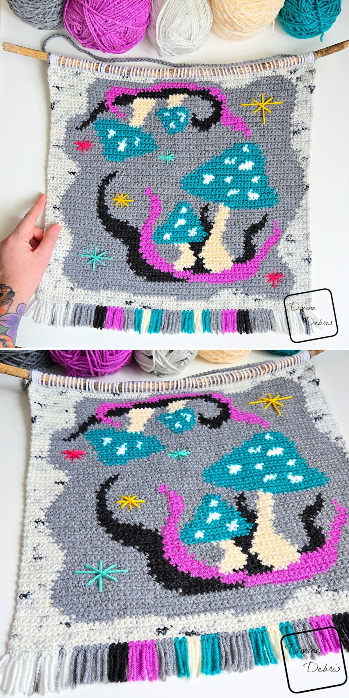 A hand holds a woven tapestry featuring blue mushrooms, stars, and purple accents on a gray background, with yarn skeins visible at the top — perfect as unique crochet home decor.