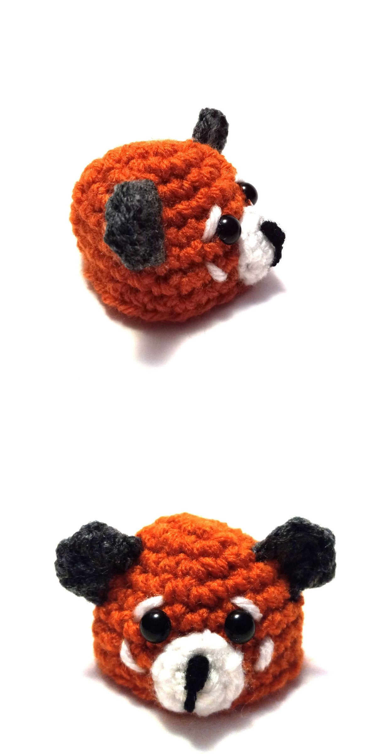A small, handmade crochet panda hat resembling a red panda with black ears, round black eyes, and a white snout, shown from two angles on a white background.