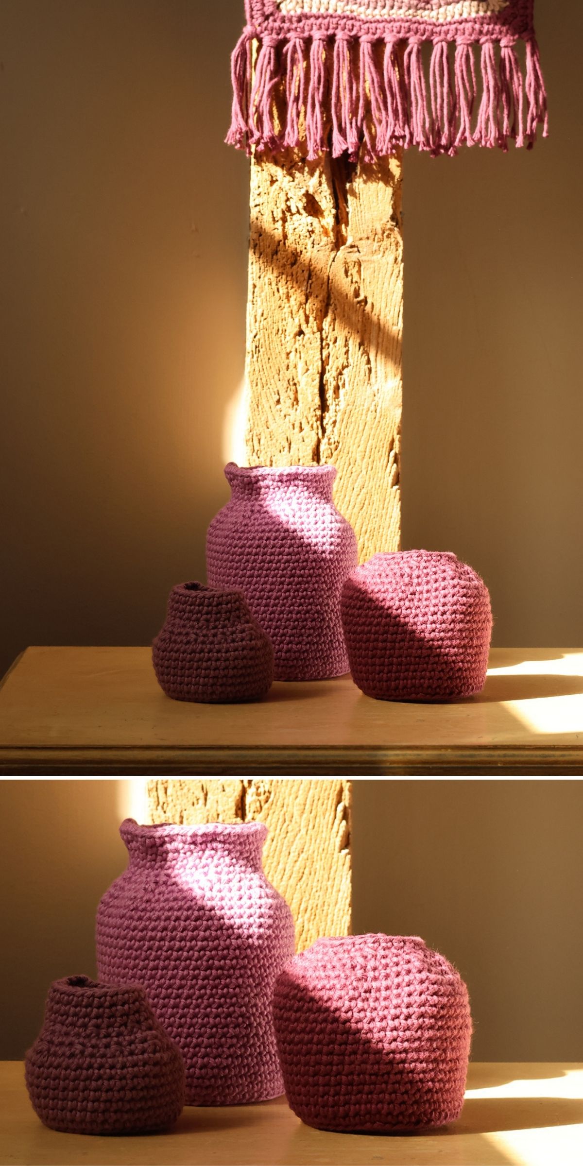 Three purple crocheted vases of different sizes, perfect for crochet home decor, are displayed on a wooden surface with sunlight streaming in, next to a wooden beam and a hanging purple woven textile.