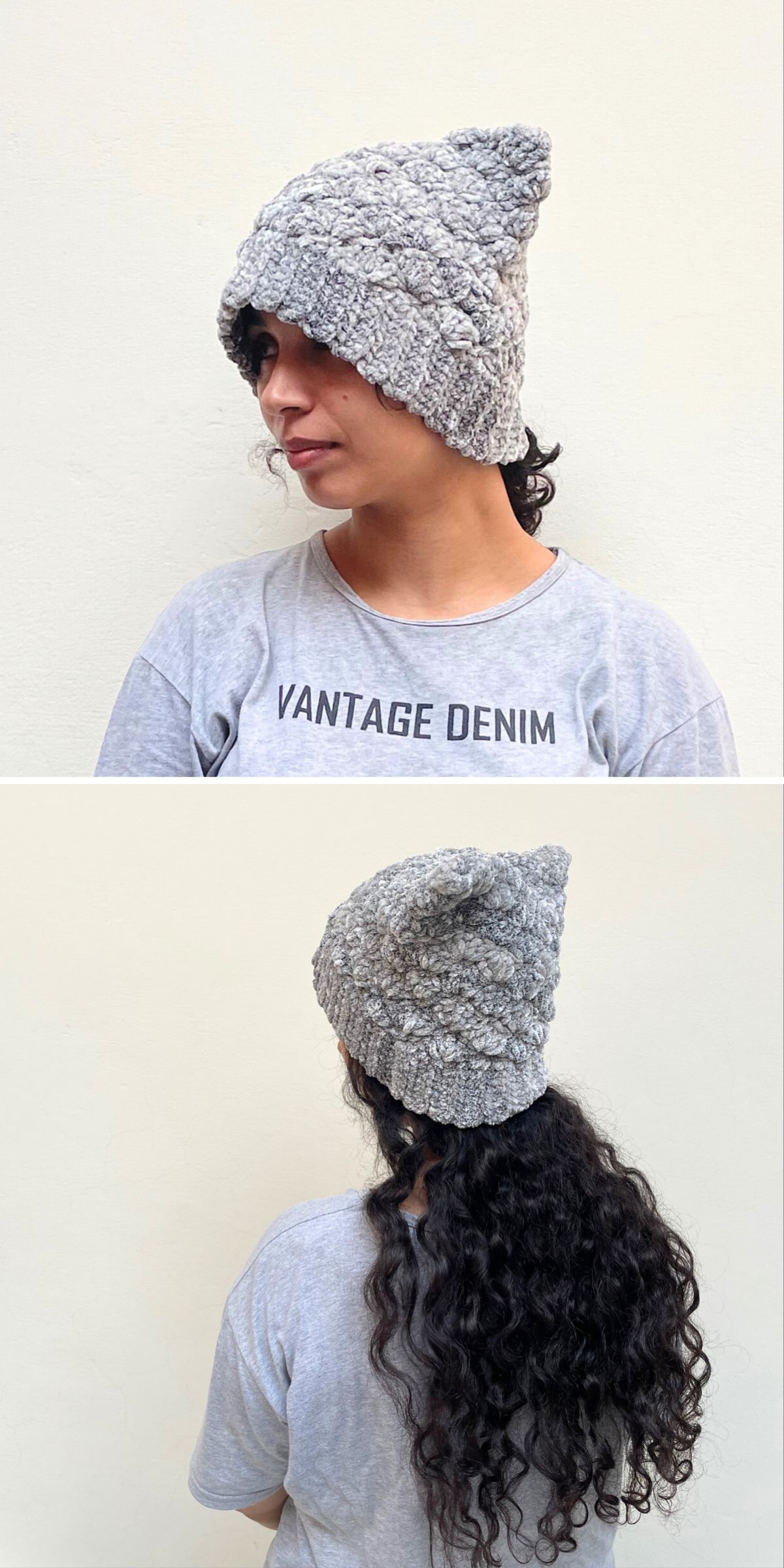 A person with curly hair models a textured gray crochet hat inspired by a crochet cat hat pattern, shown from the front and back, wearing a light gray "VANTAGE DENIM" T-shirt against a plain cream wall.