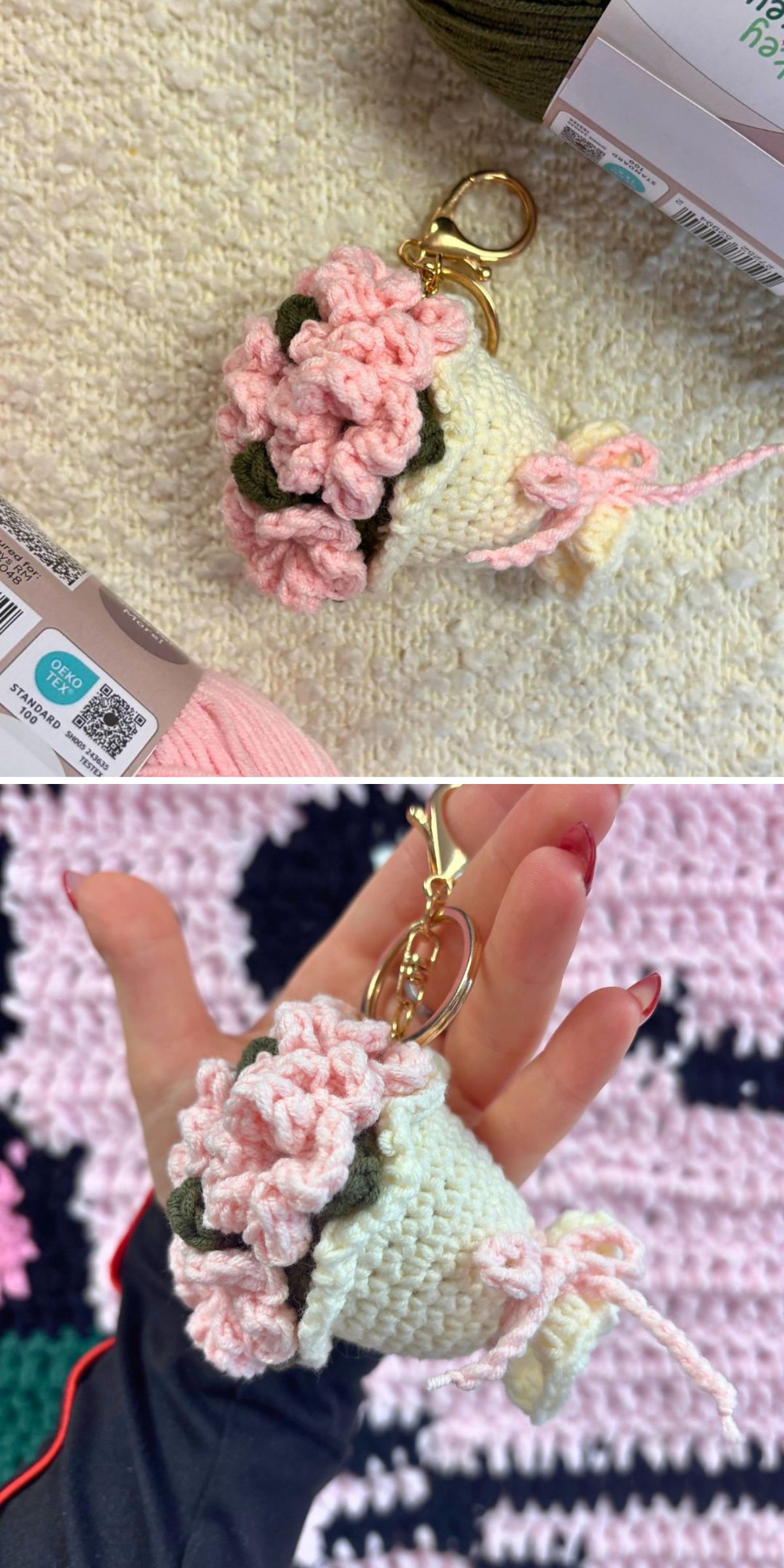 Crochet flower bouquet keychain featuring soft pink blossoms wrapped in cream-colored yarn, displayed with a gold key ring and clasp.