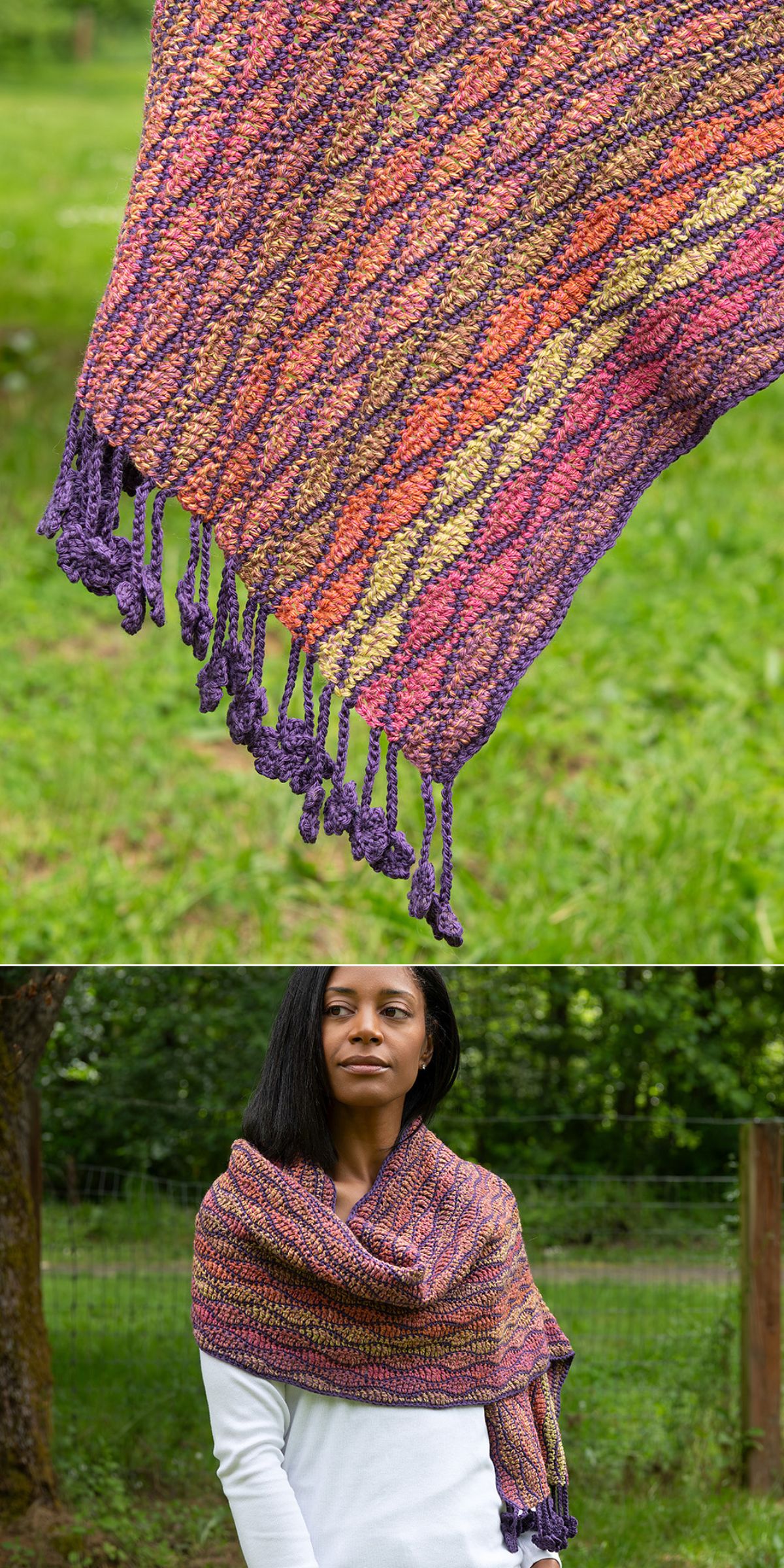 A woman stands outdoors on green grass, wearing a multicolored crochet wrap with twisted fringe, featuring shades of purple, orange, and yellow.