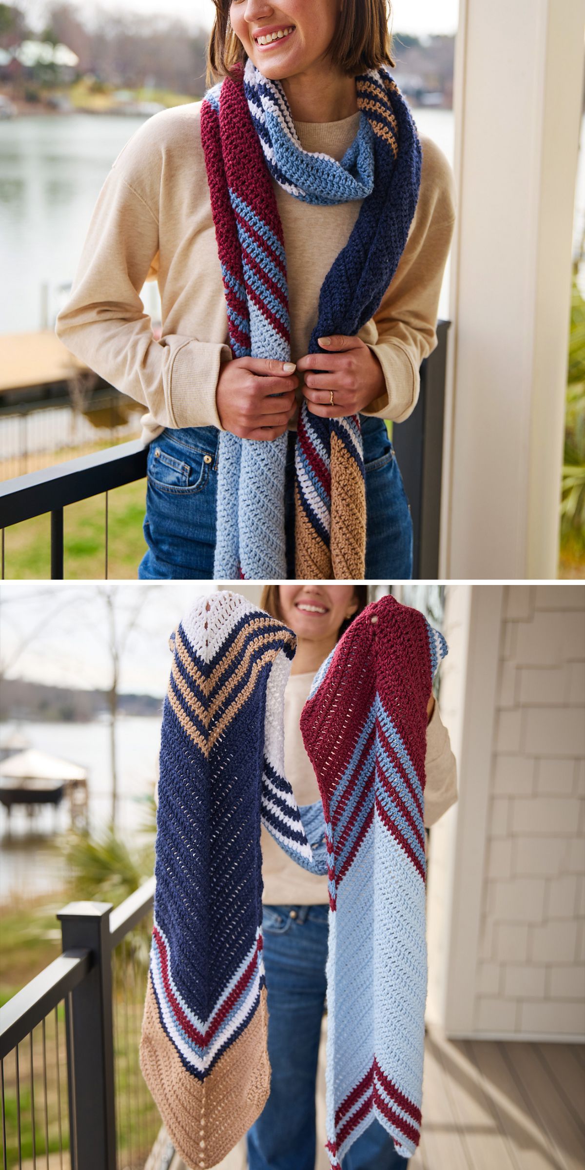 A person wearing a long, crochet wrap with blue, maroon, tan, and white stripes, shown from the waist up and holding the scarf on a porch.