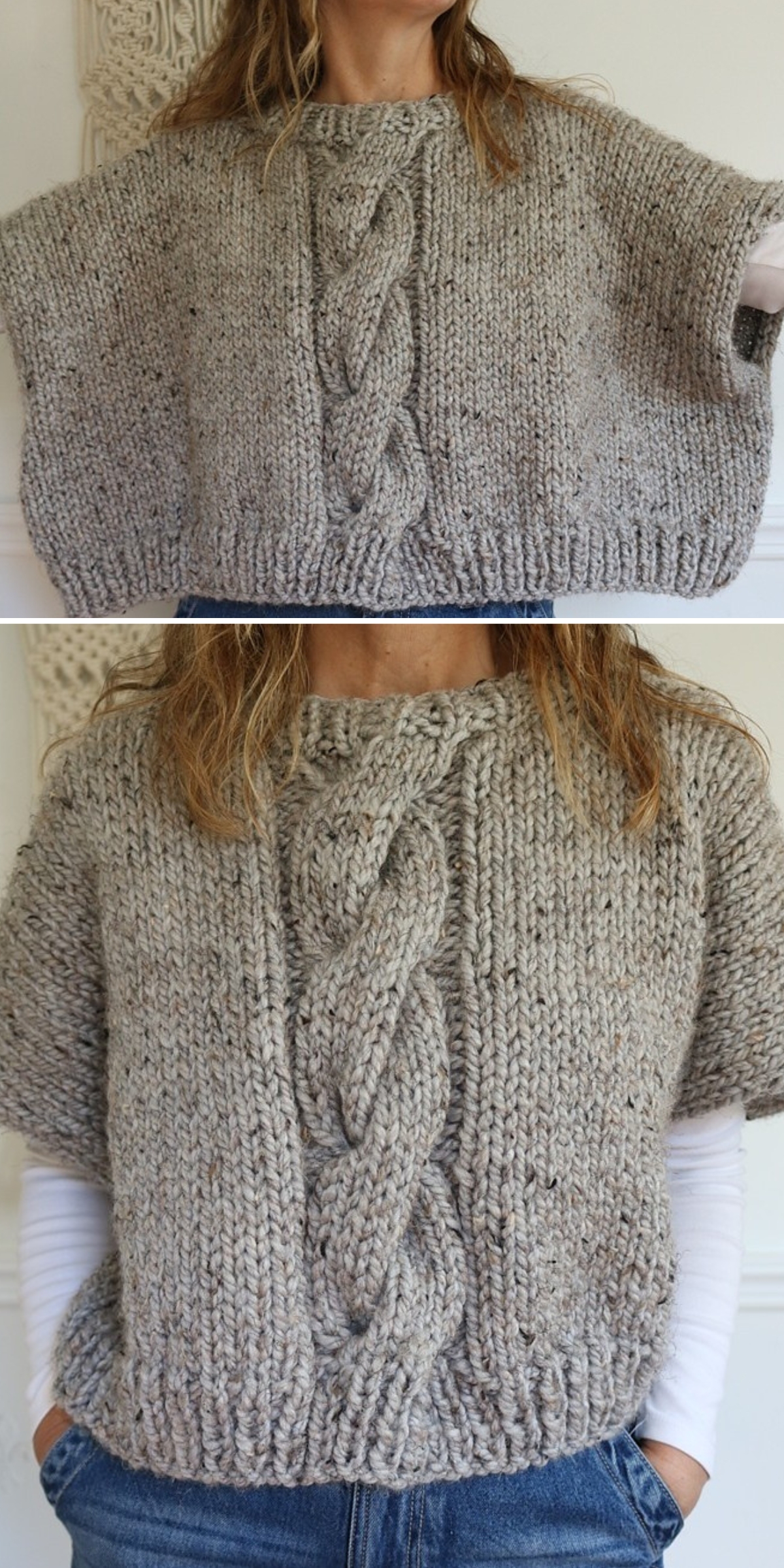 A person wearing a chunky, hand-knit gray sweater vest with a large central cable pattern — reminiscent of cozy, modern knitted ponchos — over a white long-sleeve shirt and jeans.