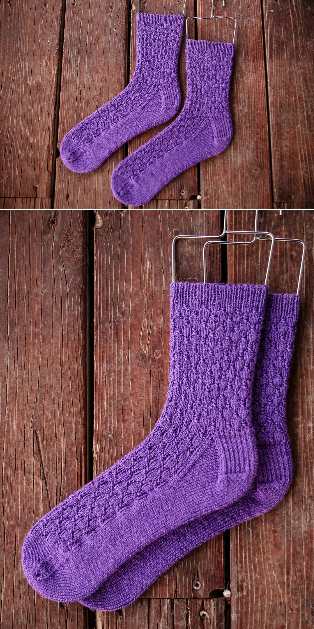 A pair of purple knitted socks with a textured sock knitting pattern, displayed on a wooden surface.