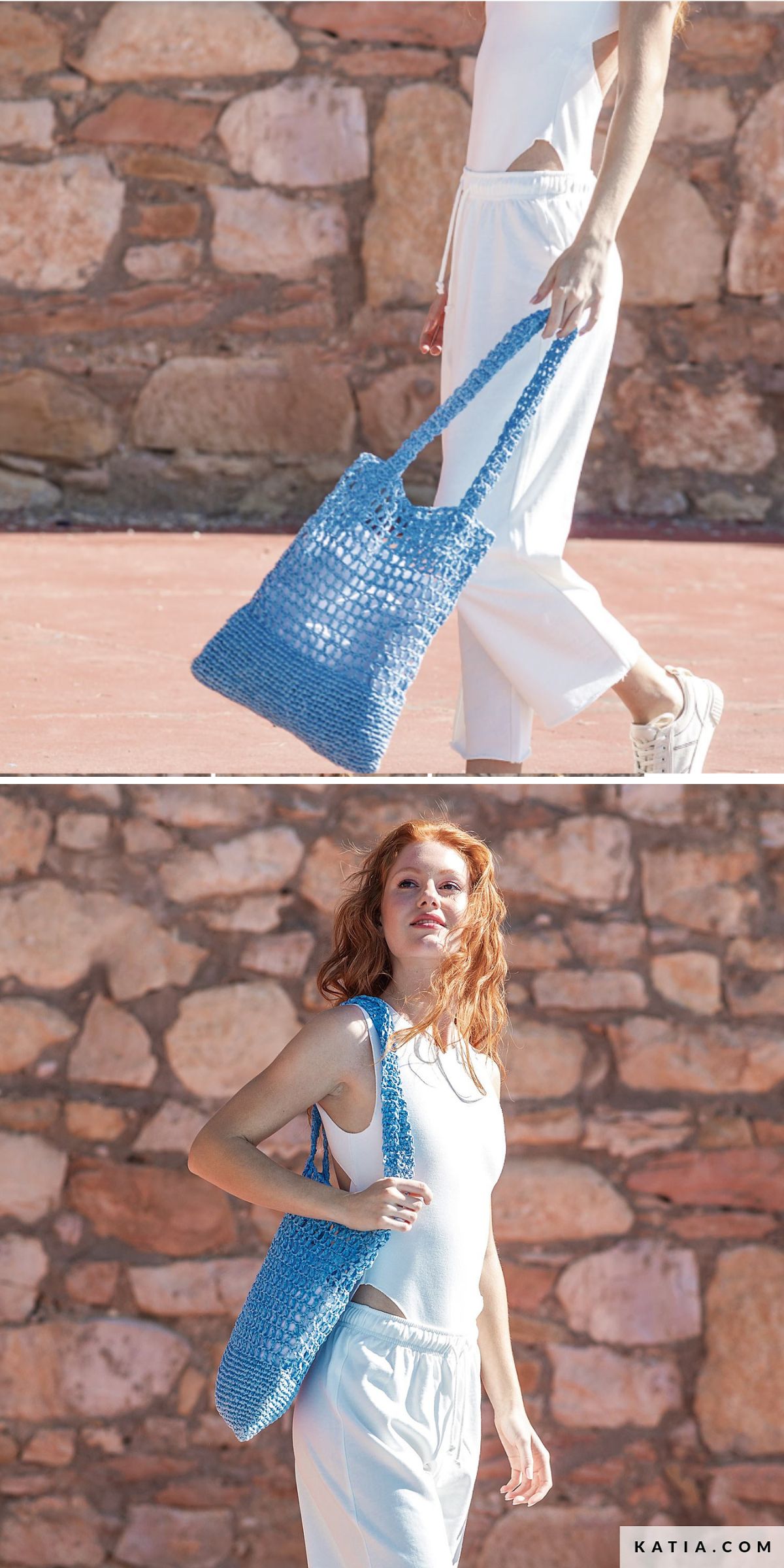 A person in a white outfit holds a blue crocheted grocery bag while standing outdoors in front of a stone wall.