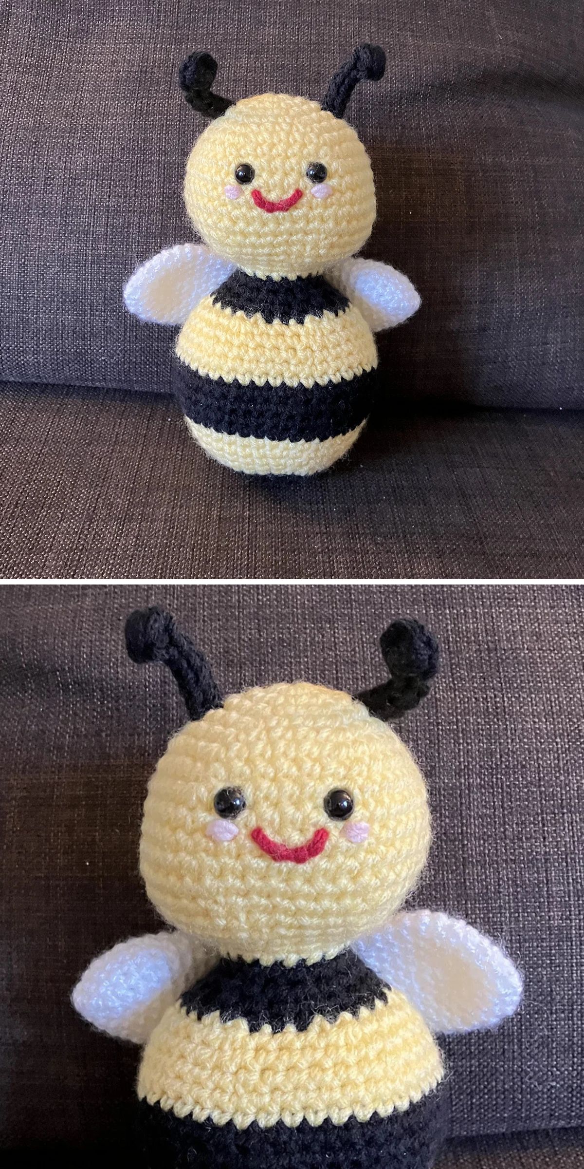 A crochet bee plush with black and yellow stripes, white wings, black antennae, and a smiling face sits on a dark fabric couch.