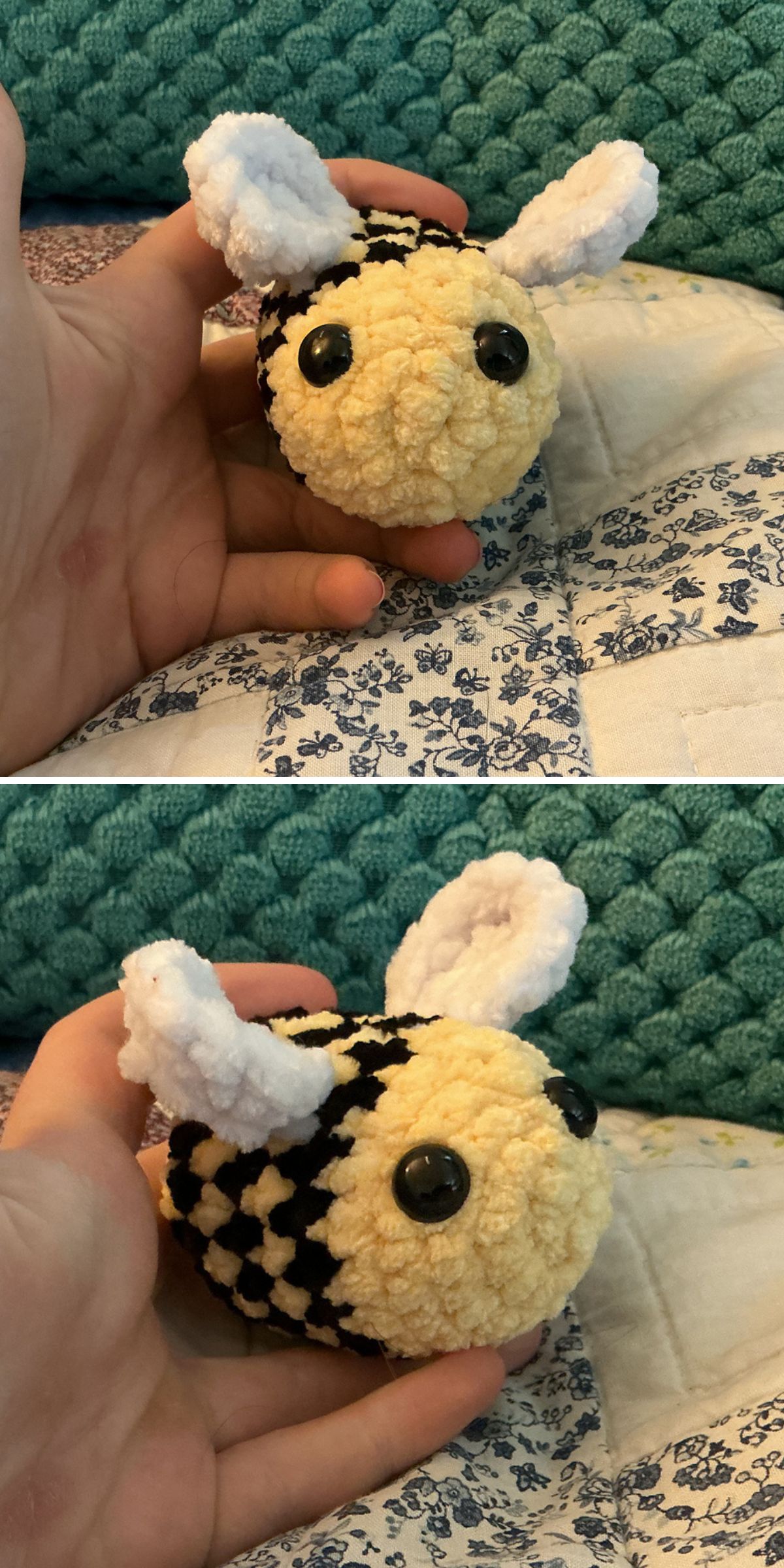 A hand holds a charming crochet bee with black and yellow stripes, white wings, and large black eyes on a patterned quilt.