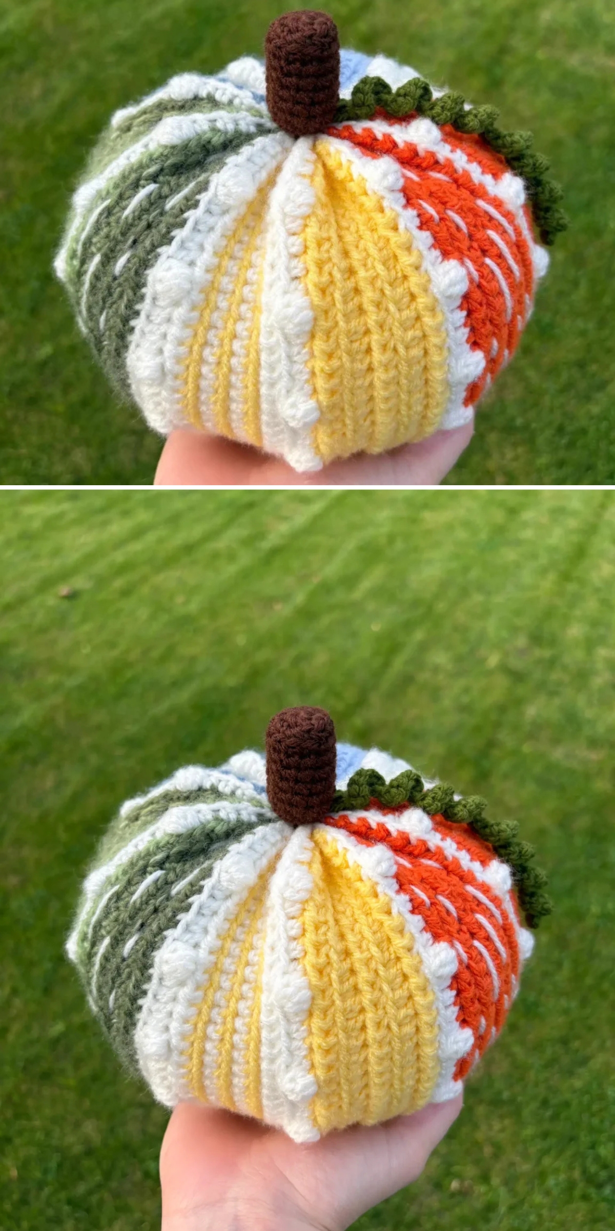A hand holds a small, halloween crochet pumpkin with alternating panels of orange, yellow, white, and green yarn and a brown stem.