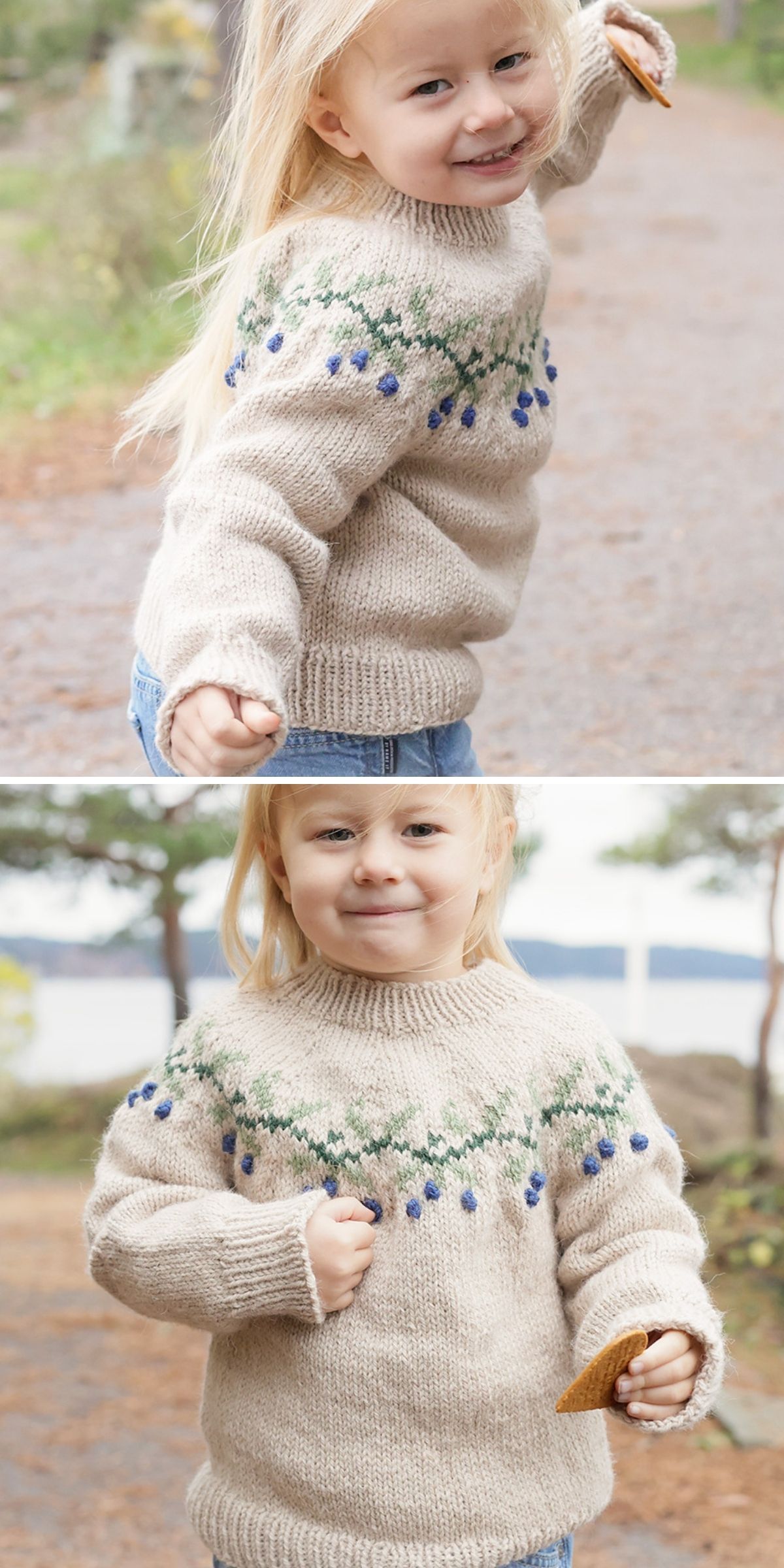 A young child wearing a beige knit baby cardigan with a green and blue berry pattern, holding a cracker.