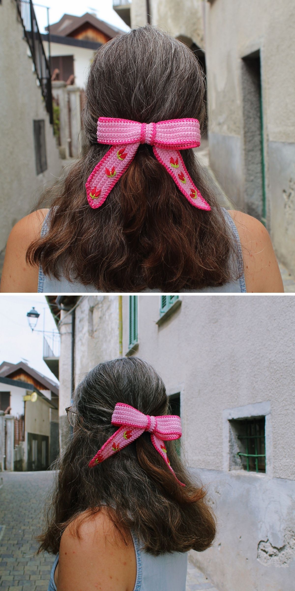 A person wearing a pink crochet bow with a red tulip pattern.